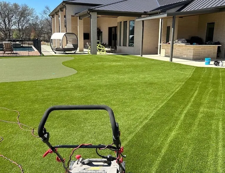 Artificial turf cleaning in Celina, Texas backyard